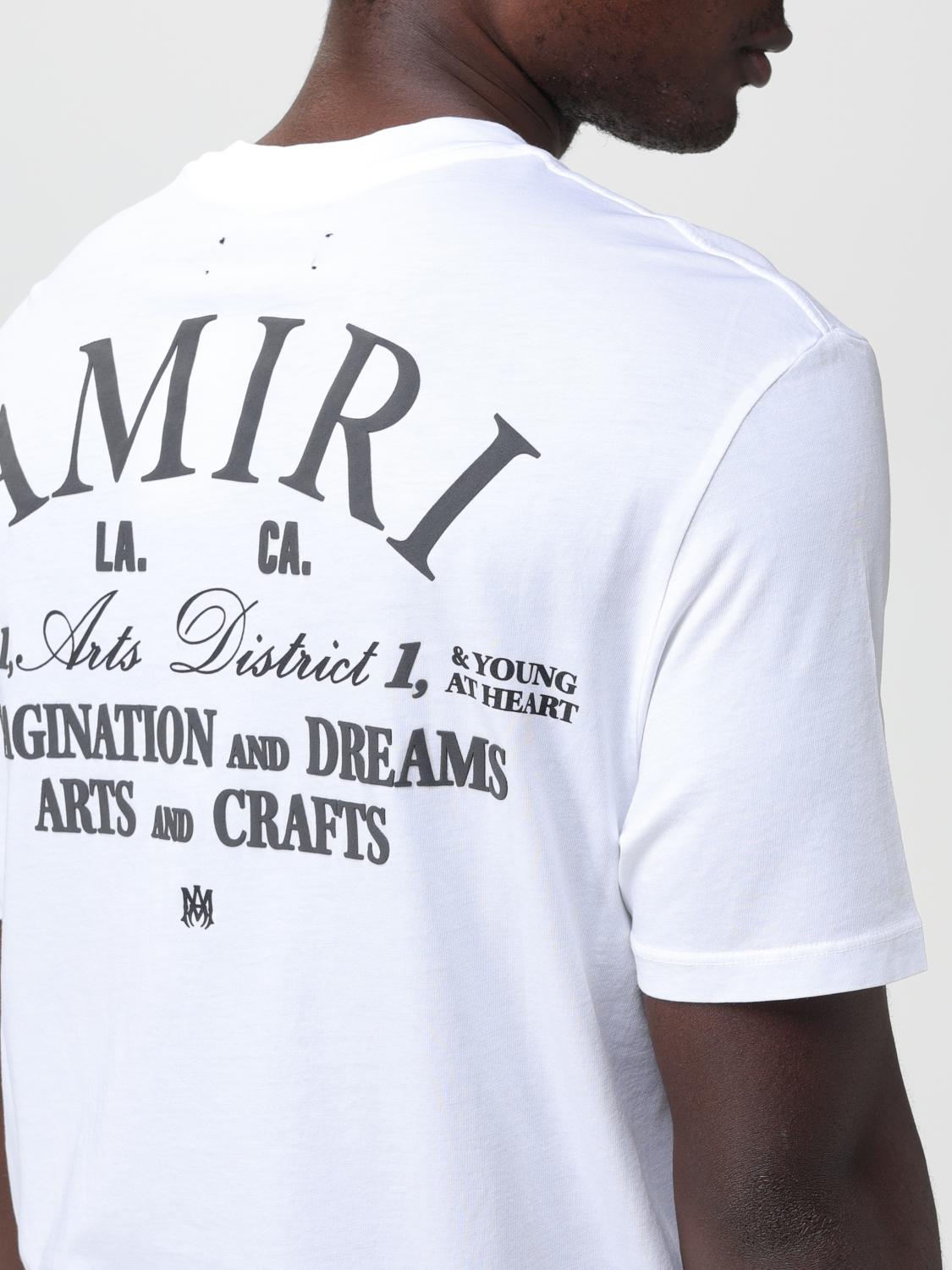 AMIRI ホワイト Tシャツ バックプリント UK46 Amiri Logo-Print T-Shirt - White | Editorialist