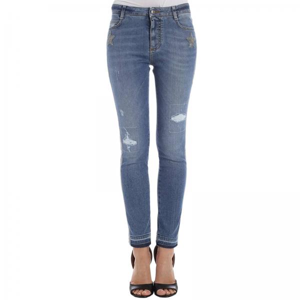 Jeans stretch used a vita bassa con rotture e bande laterali