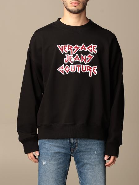 black sweatshirt and jeans