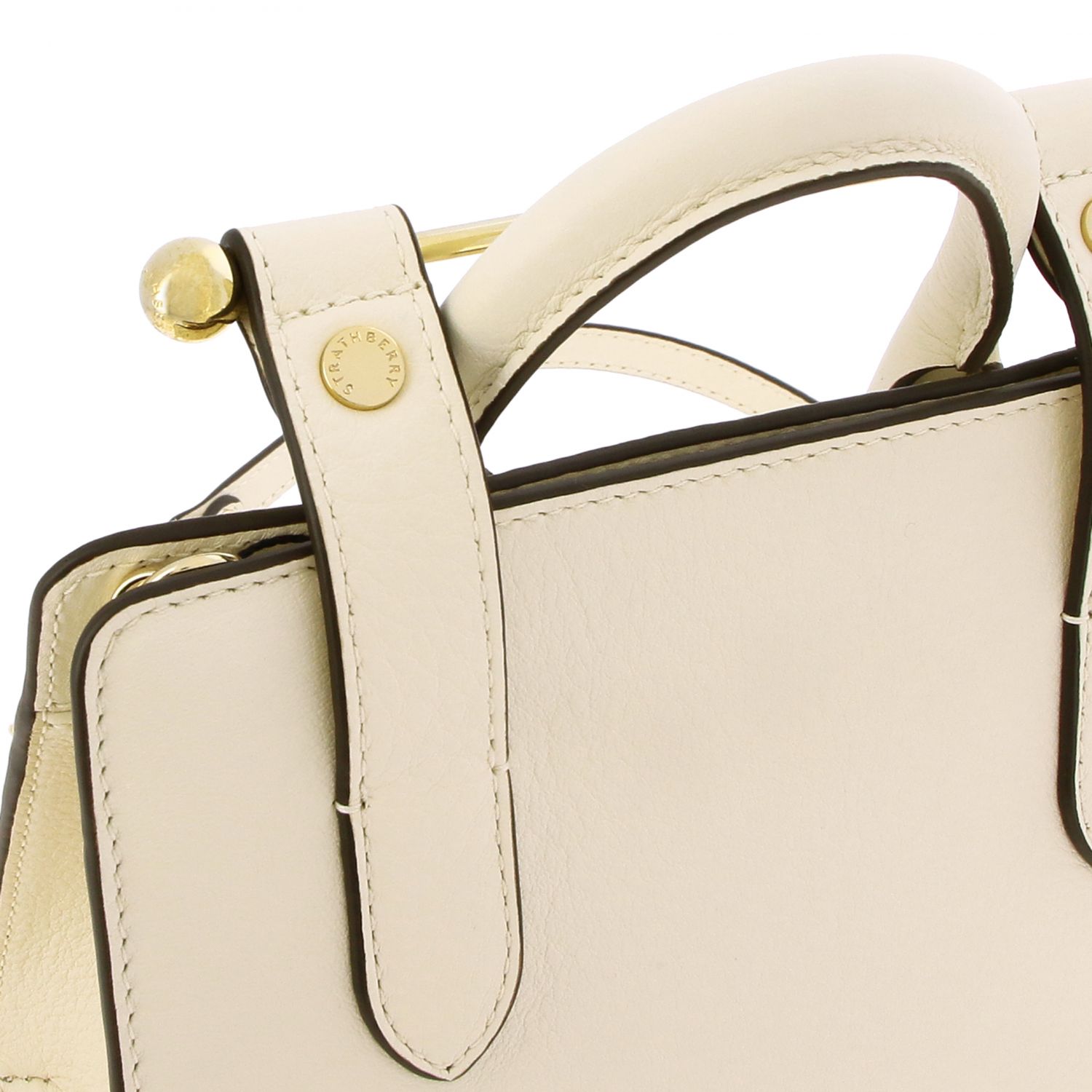 cream over shoulder bag