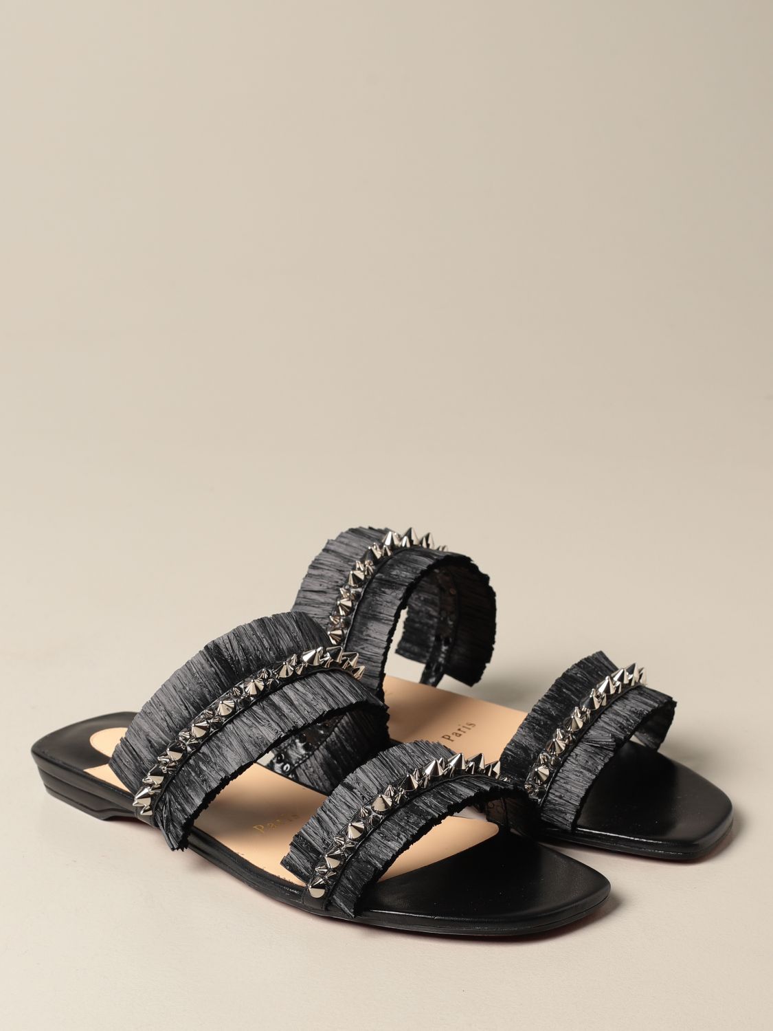 CHRISTIAN LOUBOUTIN: Marivodu sandals in raffia with studs | Flat