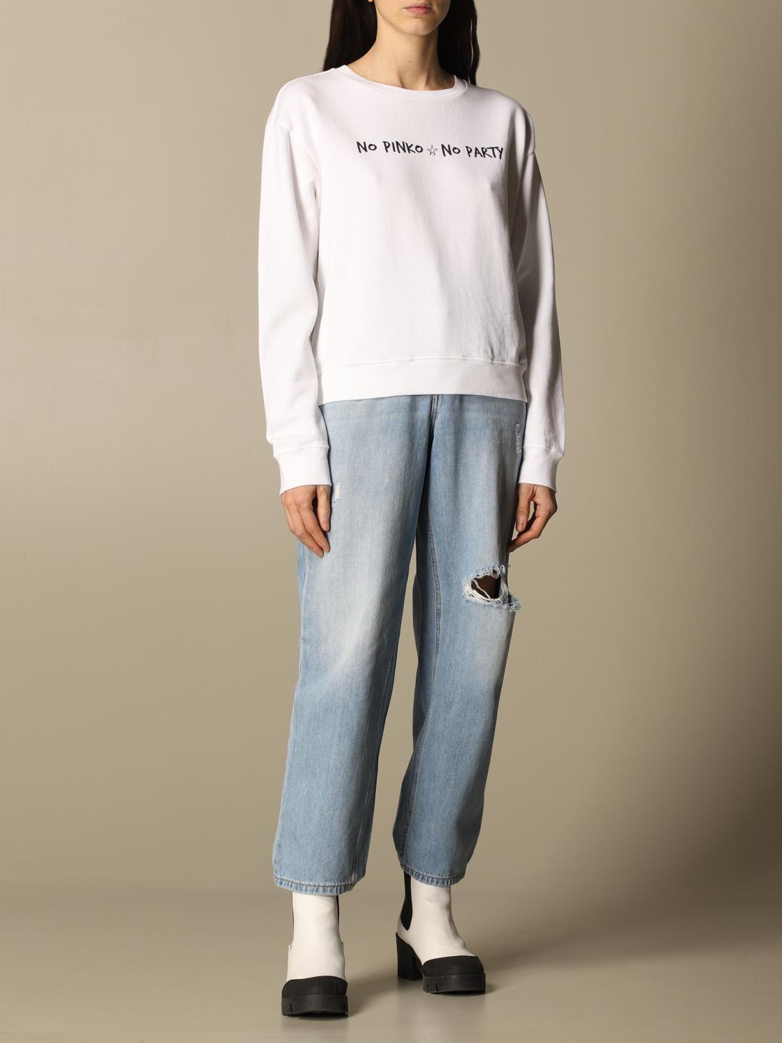 white sweatshirt with green writing