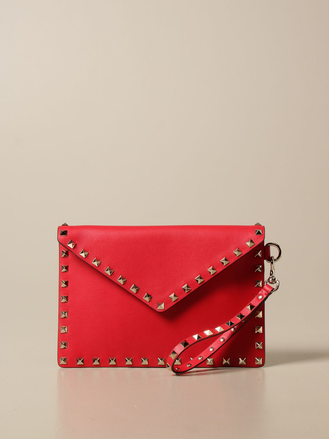 VALENTINO GARAVANI: Rockstud envelope clutch in leather with studs - Red