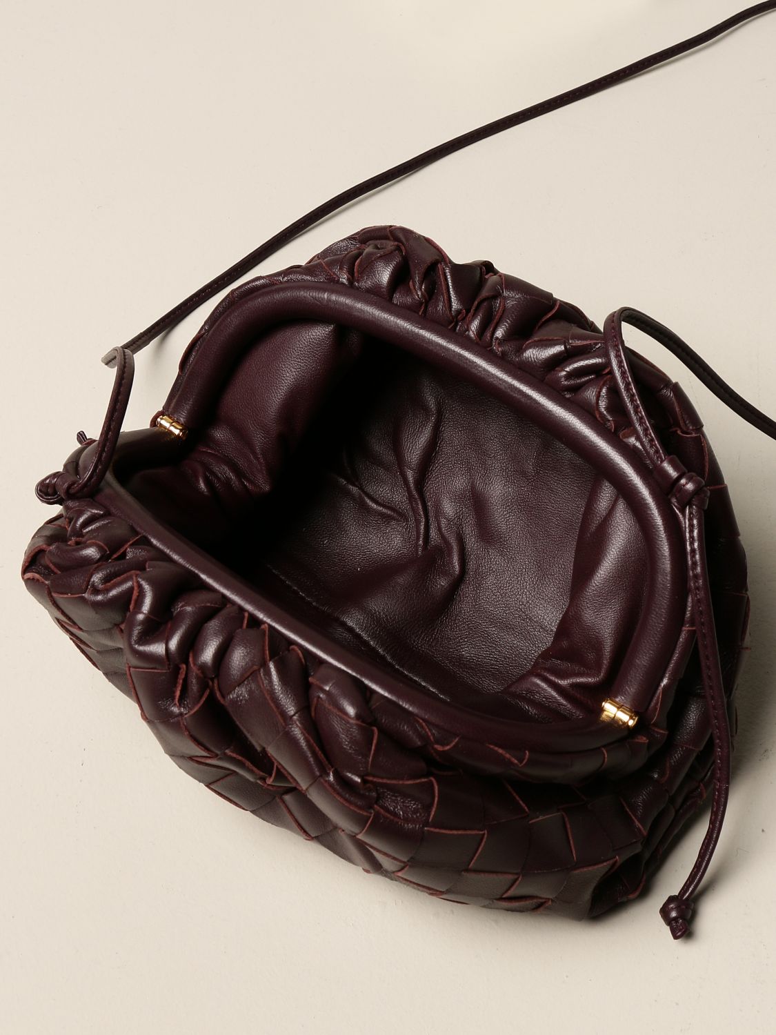 BOTTEGA VENETA: The mini pouch clutch in woven leather | Crossbody Bags