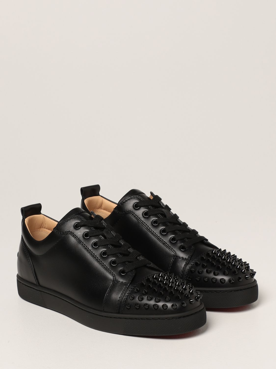 CHRISTIAN LOUBOUTIN: Louis Junior sneakers in leather with studs ...
