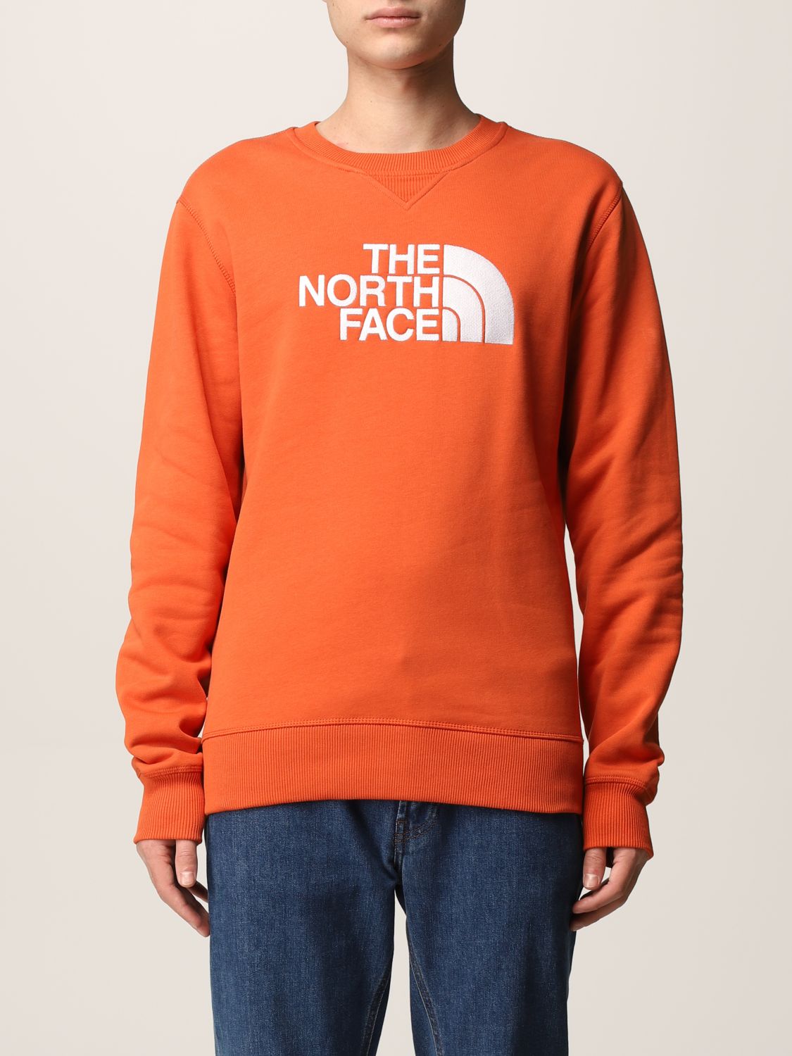 Felpa The North Face: Felpa The North Face in cotone con logo arancione 1