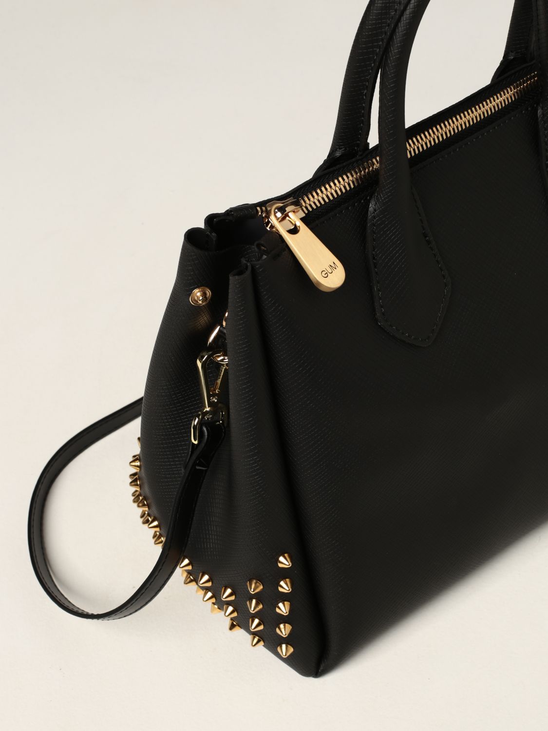 Rubber Dinner merge GUM: bag in pvc with studs - Gold | Gum tote bags BS 1900T/21AI STUDS  online on GIGLIO.COM