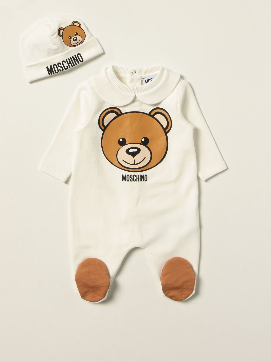 Pack Moschino Baby: Moschino Baby footed romper + hat set white 1