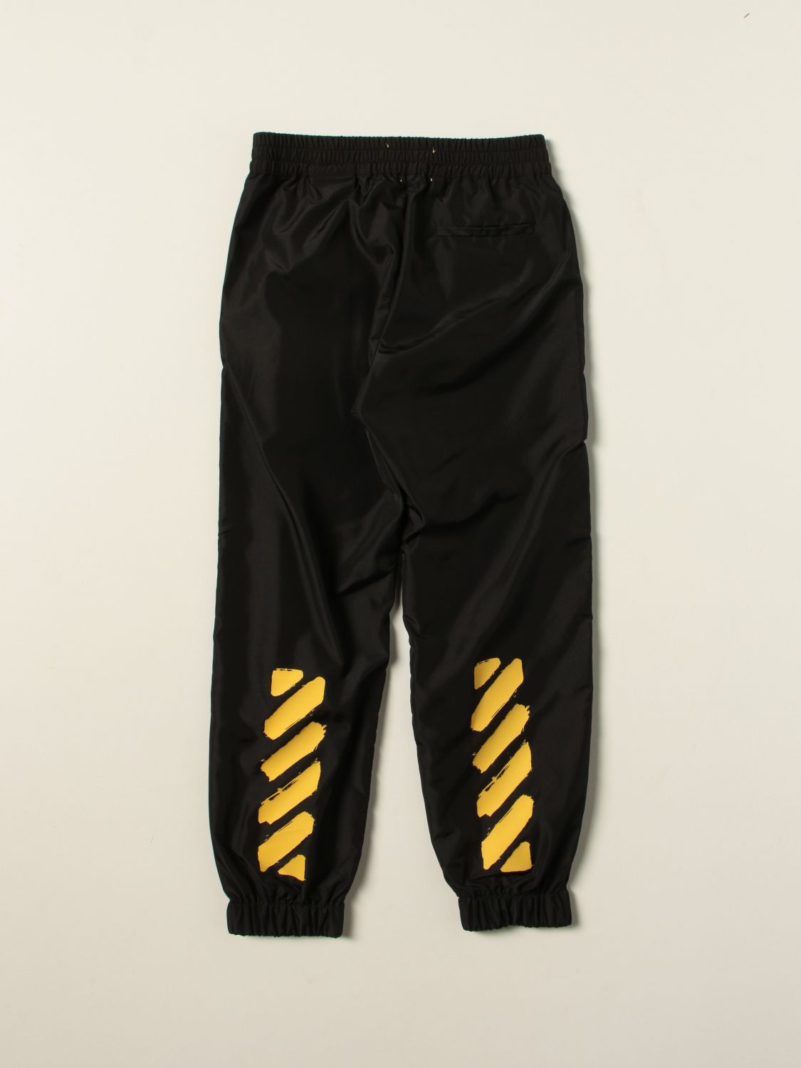 off white pants with yellow stripe