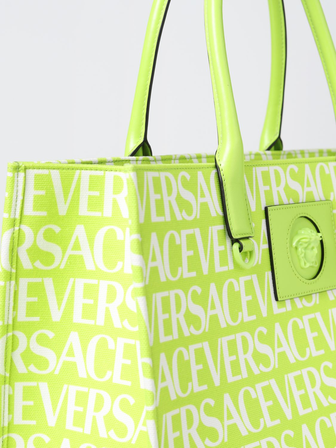 VERSACE: bag in canvas with all over logo - Pink  Versace tote bags  10047411A06544 online at