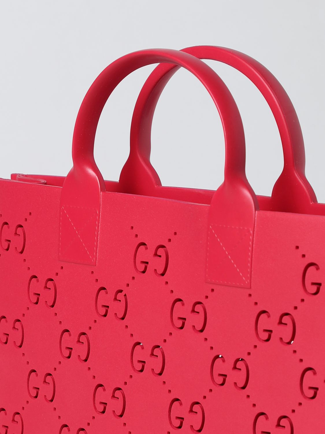 GUCCI: Rubber bag with perforated GG monogram - Red | Gucci bag 679365JFO00  online on 