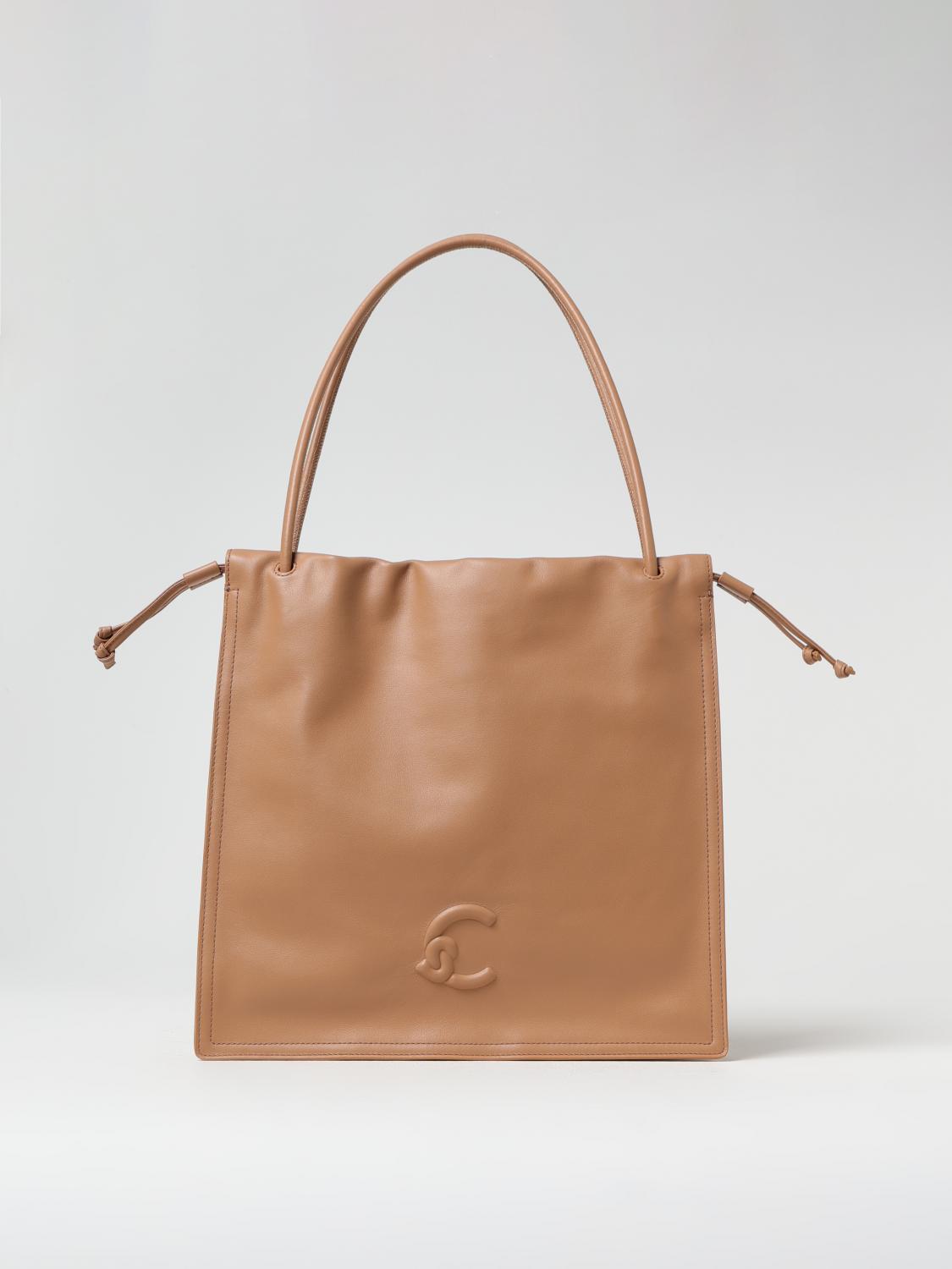 Coccinelle Logo Embossed Drawstring Tote Bag In Beige