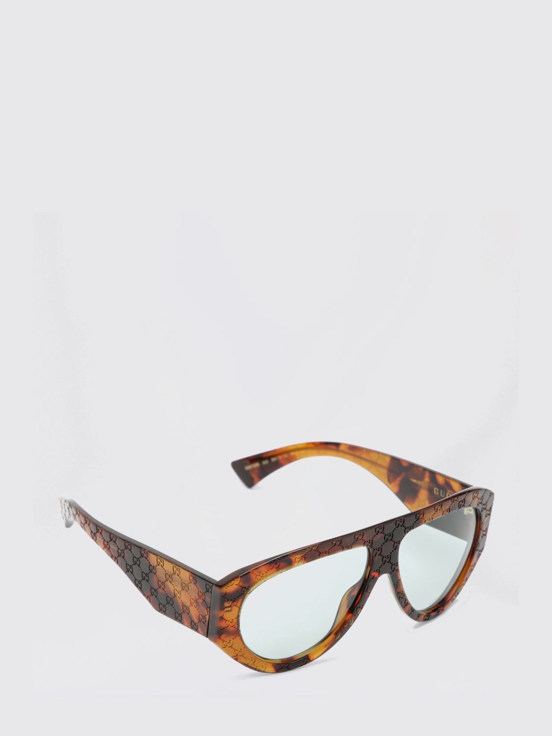 GUCCI Occhiali da sole in acetato tartarugato con monogram GG impresso