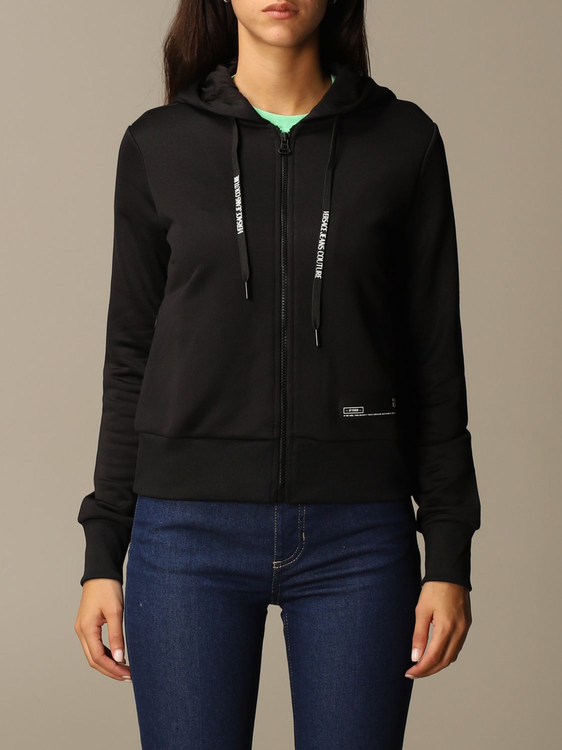 black sweatshirt and jeans