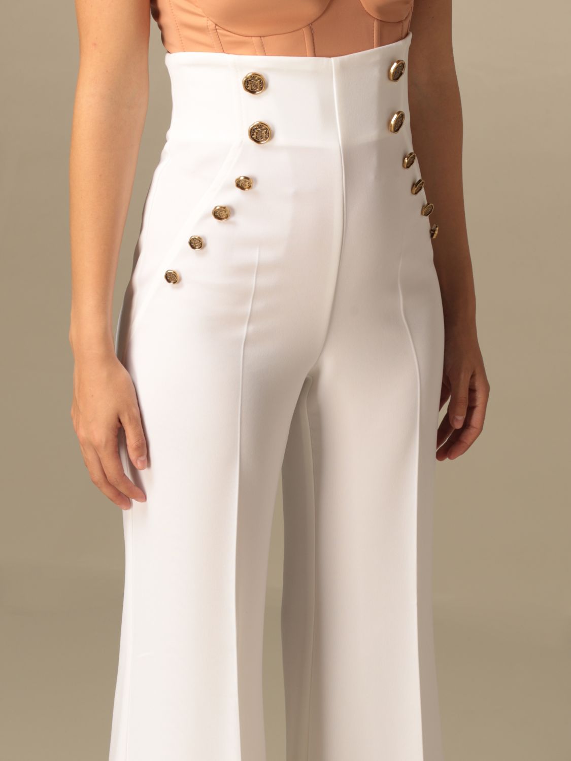 beige flared trousers