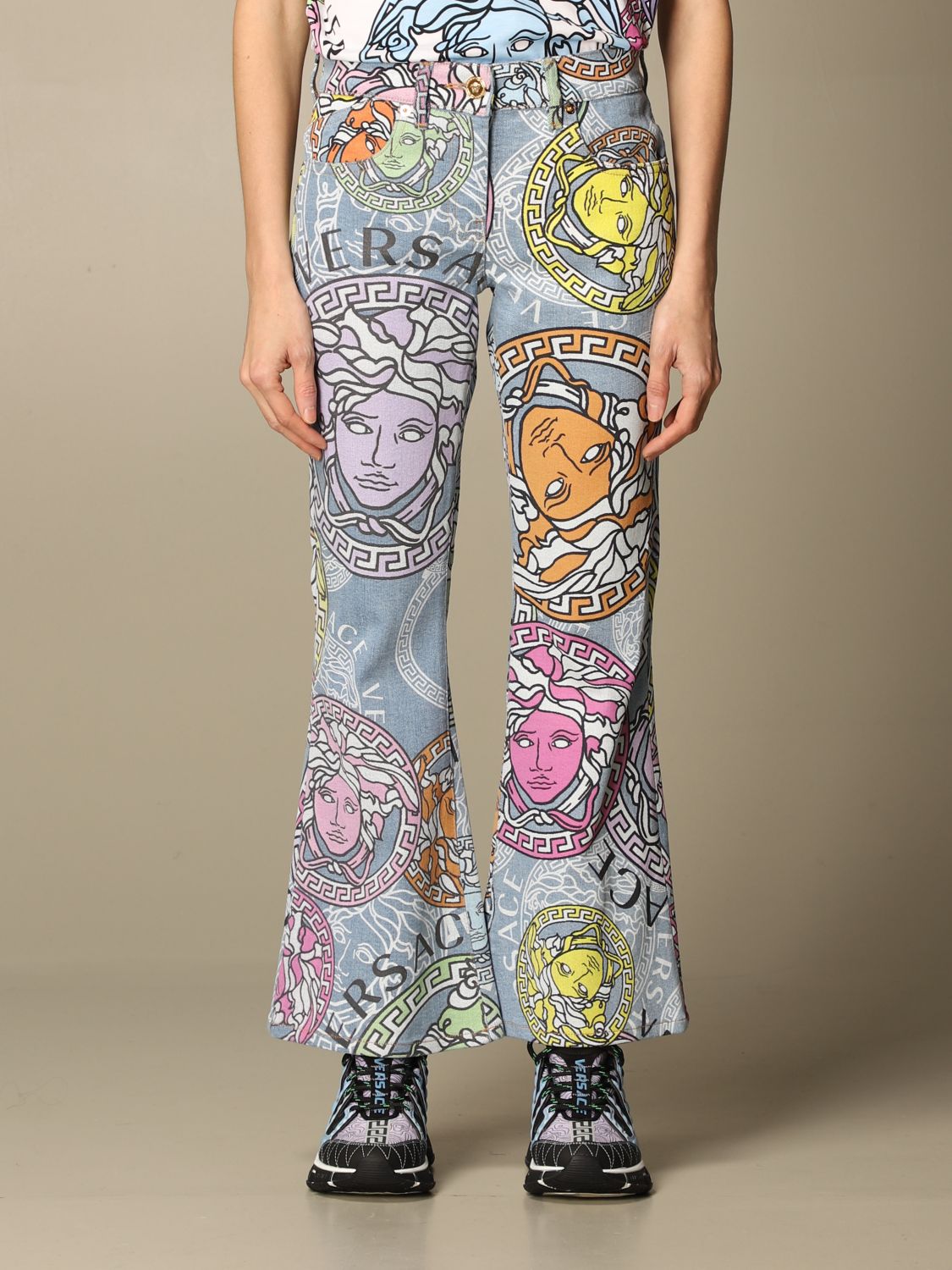 VERSACE: jeans with all-over Medusa head prints - Multicolor | Versace ...