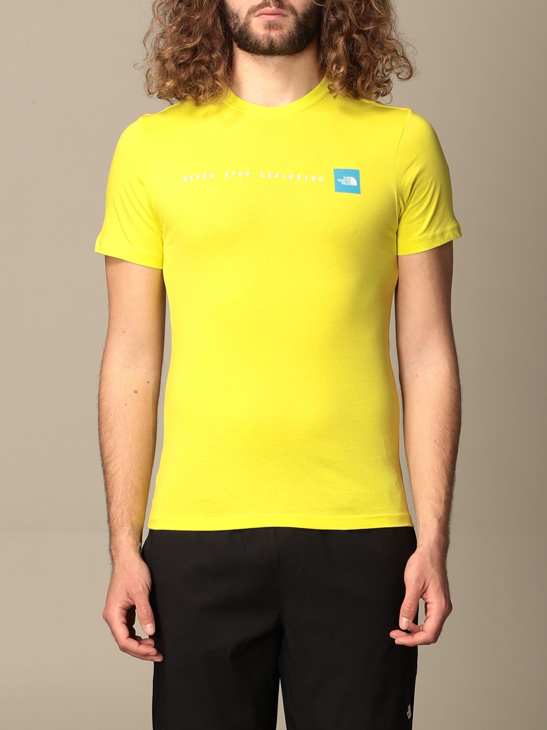 yellow north face top