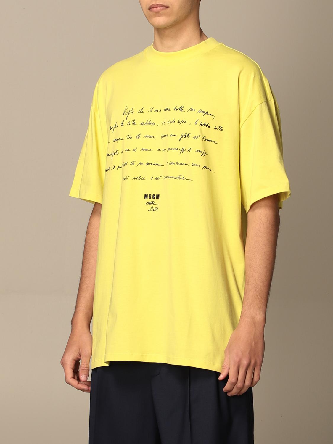 white shirt with yellow writing