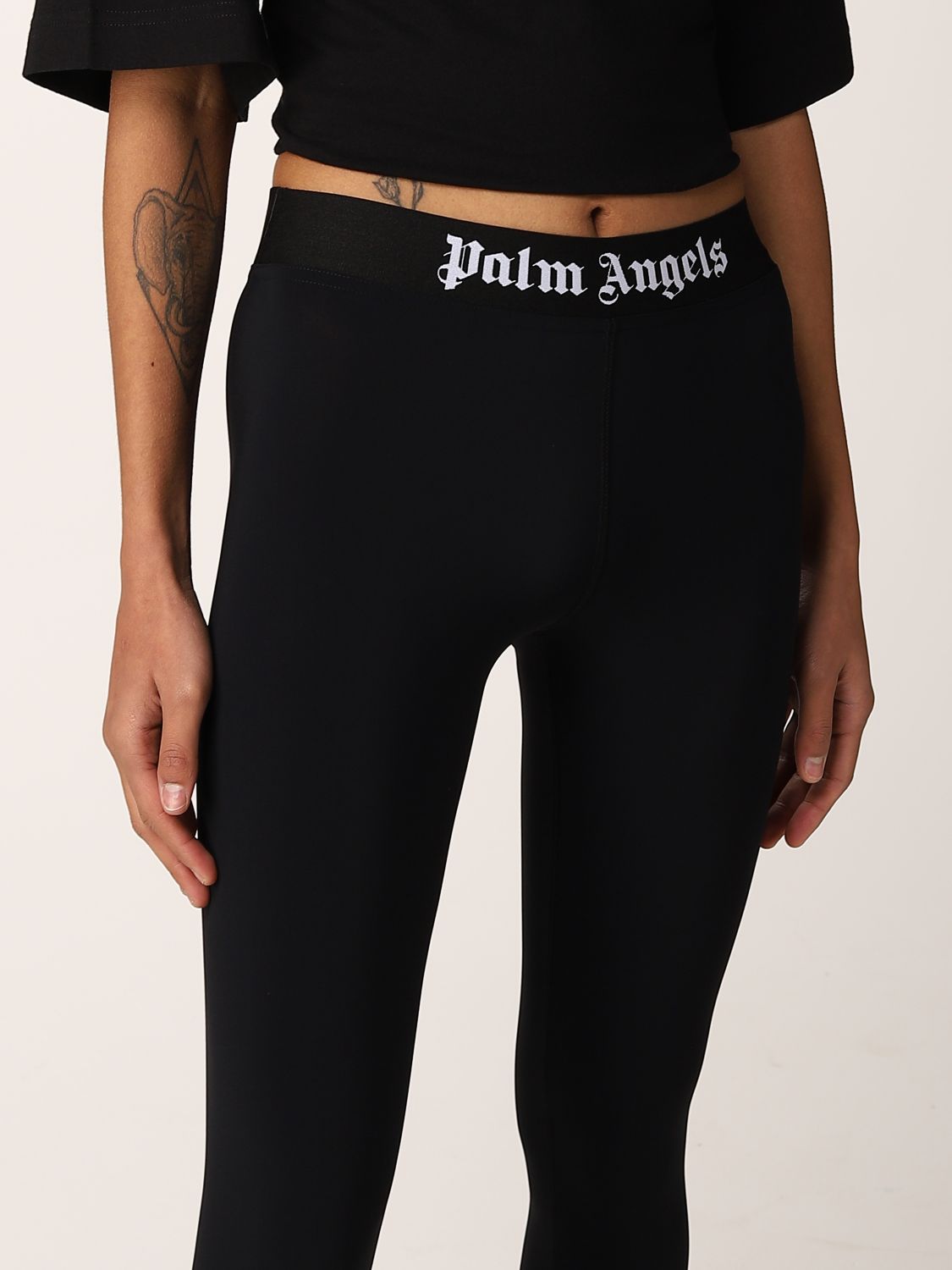 PALM ANGELS: stretch leggings with logo - Black | Trousers Palm Angels