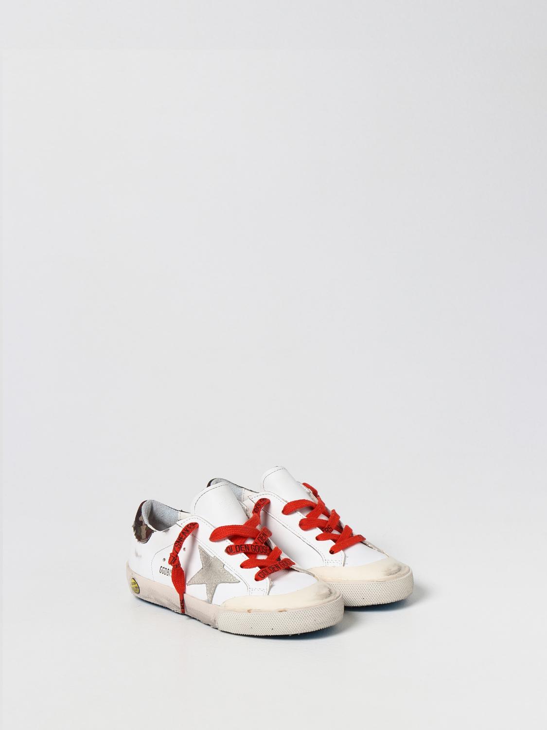 white sneakers with red heart and eyes
