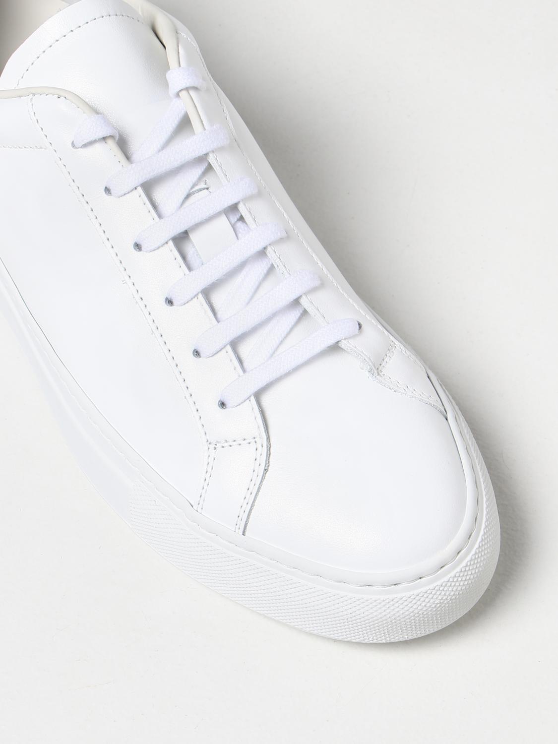 white shoes like common projects