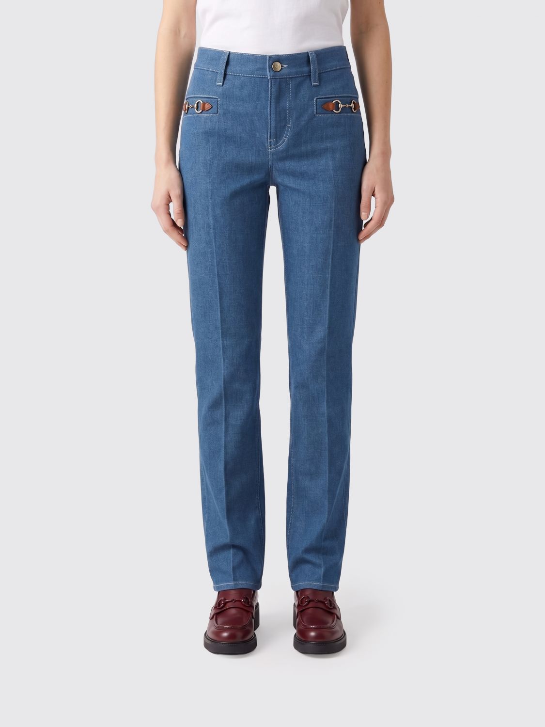 GUCCI Jeans slim fit in denim con morsetto