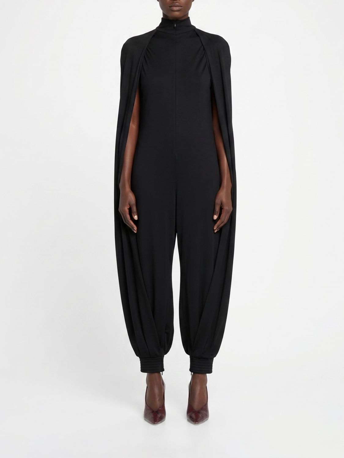 ALAÏA Pure Wool Jumpsuit with High Neck and Ruched Shoulders