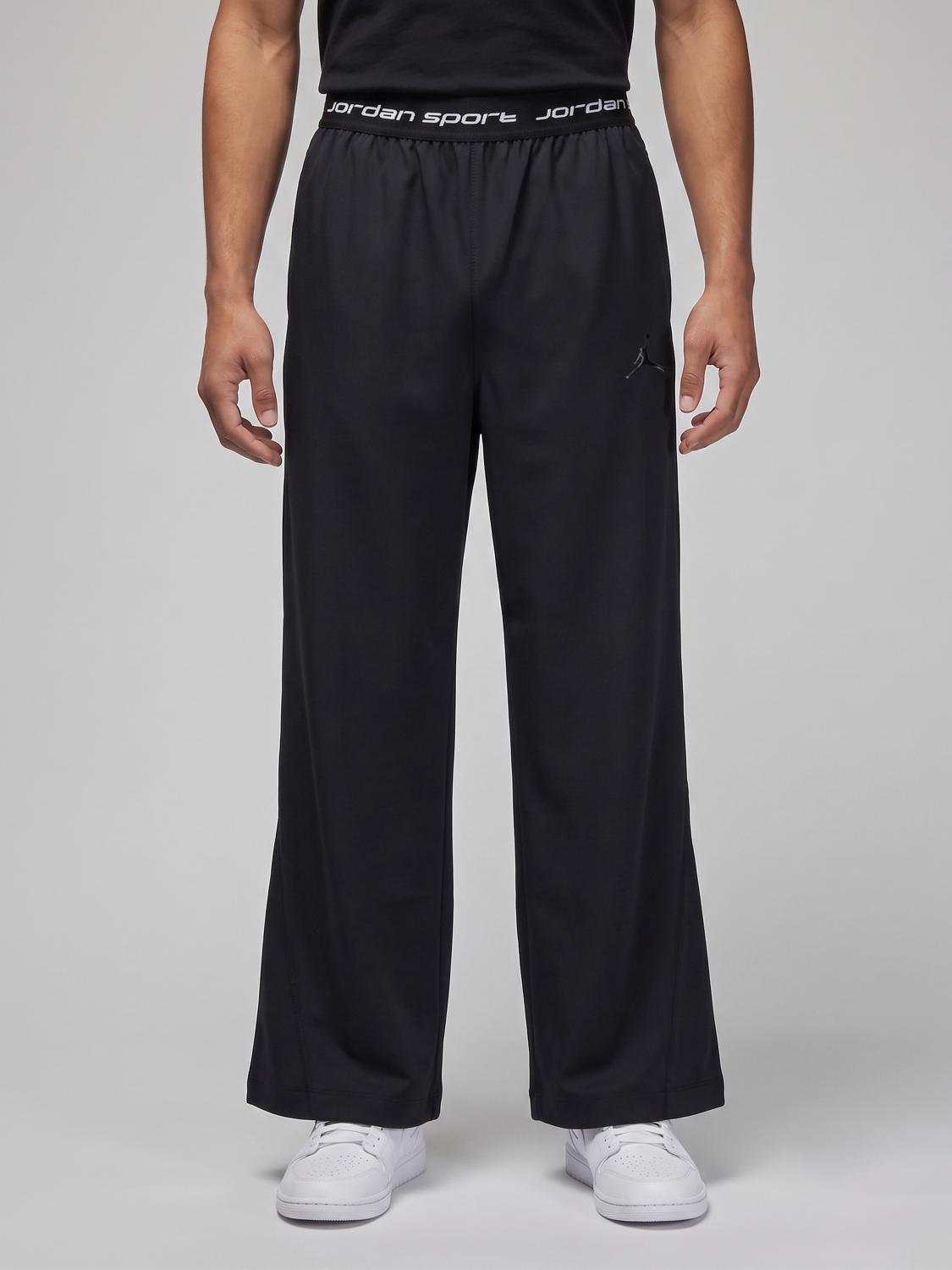 NIKE Jogging Trousers in Stretch Tech Fabric with a High Waist and Logo Band