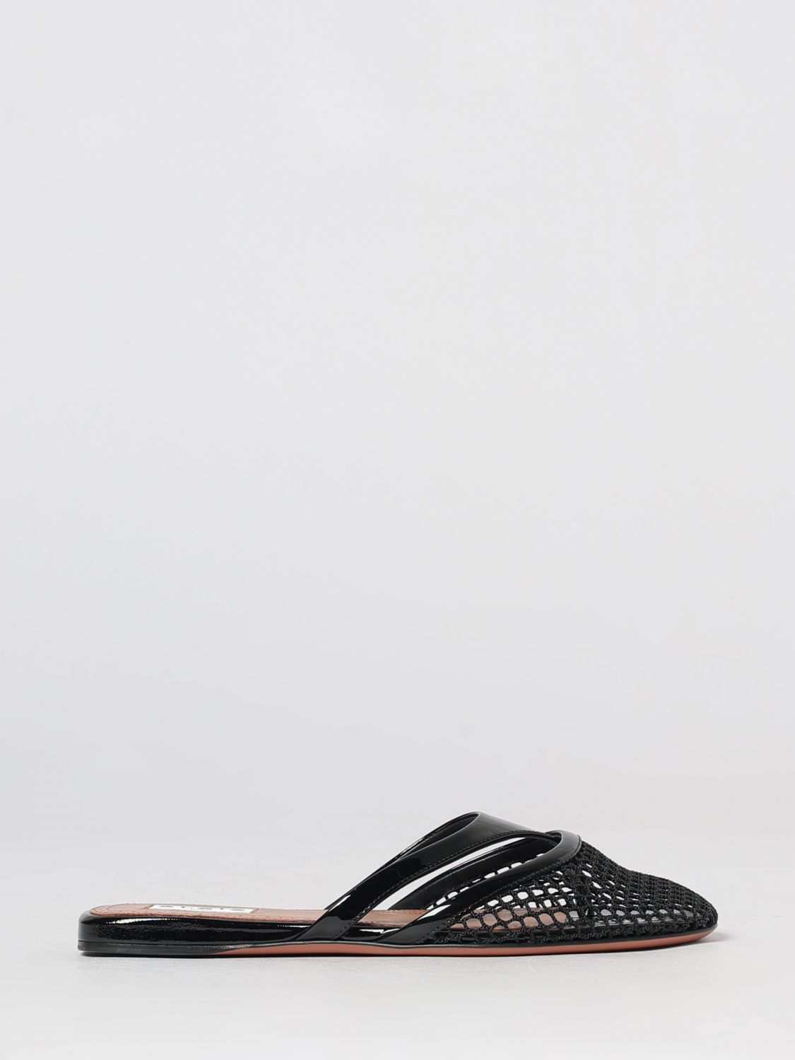 ALAÏA Low Thong Mules in Patent Leather and PVC with Perforated Pattern ALAÏA Low Thong Mules in Patent Leather and PVC with Perforated Pattern