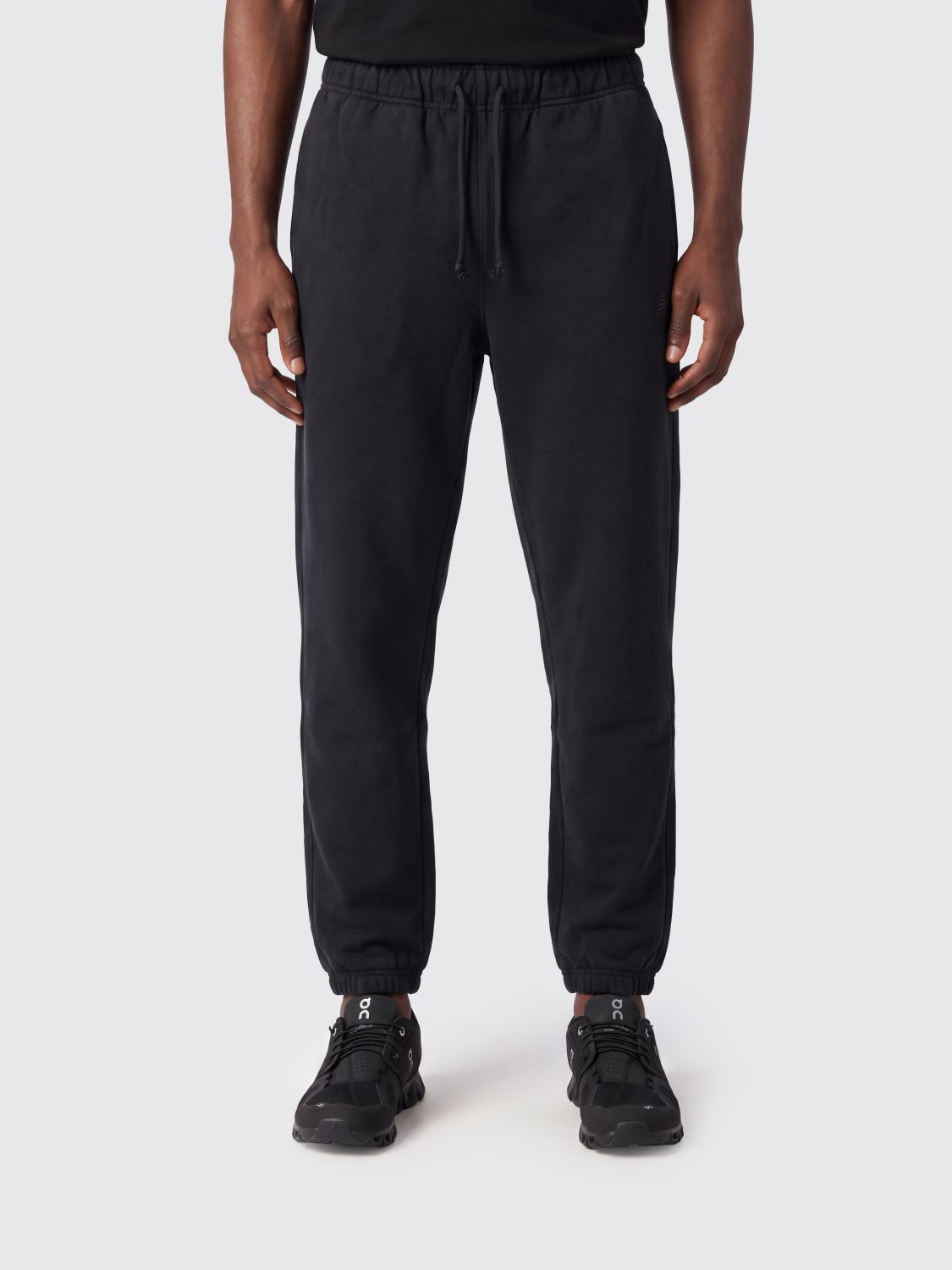 NEW BALANCE Pants Men color Black