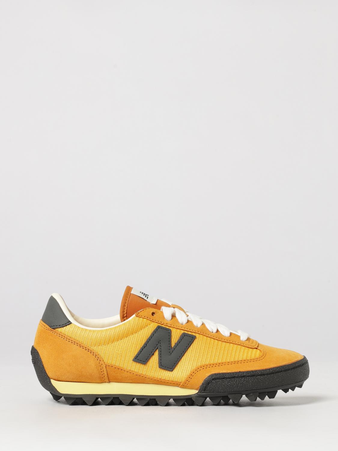 NEW BALANCE Sneakers Men color Orange