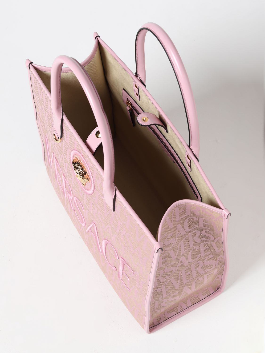 VERSACE: bag in canvas with all over logo - Pink  Versace tote bags  10047411A06544 online at